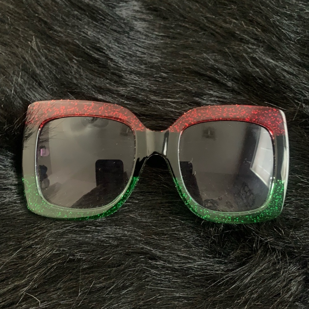 Excellent condition sunglasses red and green shimmer design and black accent.